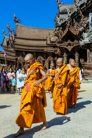 Pattaya, Thailand - March 25, 2022: Ceremonial Procession of the Young Monks in the traditional Orange Dressing in the Sanctuary of Truthのeditorial素材