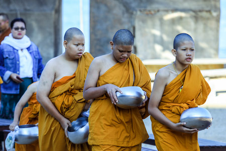 Pattaya, Thailand - March 25, 2022: Ceremonial Procession of the Young Monks in the traditional Orange Dressing in the Sanctuary of Truthのeditorial素材