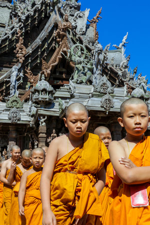 Pattaya, Thailand - March 25, 2022: Ceremonial Procession of the Young Monks in the traditional Orange Dressing in the Sanctuary of Truthのeditorial素材
