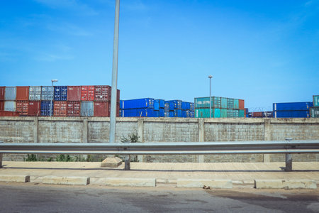 Lome, Togo - March 05, 2023: West African Ocean Port with Cargo Shipping Containers