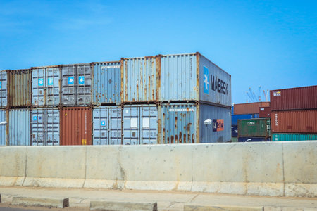 Lome, Togo - March 05, 2023: West African Ocean Port with Cargo Shipping Containersのeditorial素材