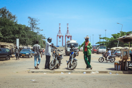 Lome, Togo - March 05, 2023: Togolese Road with People and Carsのeditorial素材