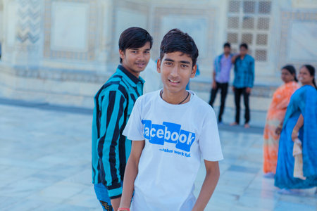 Agra, India - March 05, 2023: Local Indian People visiting the Taj Mahal in the Sunny Day