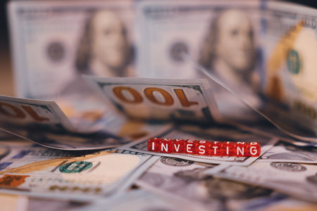 United States Dollar Banknotes with the Red Cubes Title Investingの写真素材