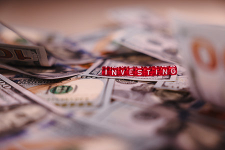United States Dollar Banknotes with the Red Cubes Title Investingの写真素材