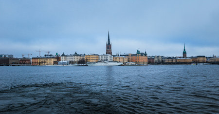Aerial View of Large Body of Water With Buildings in Backgroundの写真素材