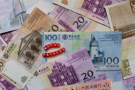 Stack of Macao Money Patacas With Red Cubesの写真素材