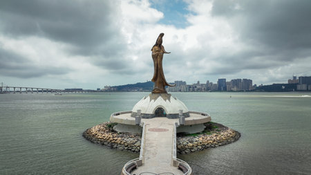 Majestic Guan Yin Statue Standing in Macaus Watersの写真素材