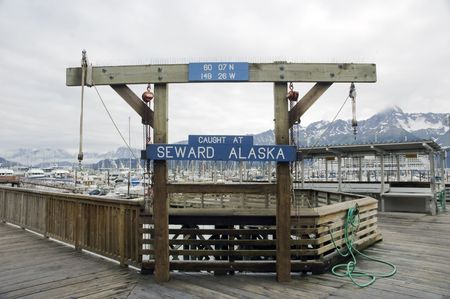 A sign at Seward Harbor in Alaska used to display the fish caughtの写真素材