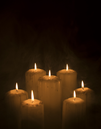 Moody candles with smokeの写真素材