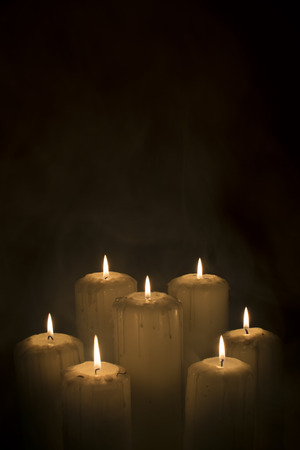 Moody candles with smokeの写真素材