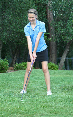 Pretty female teen golfer with extraordinary formの写真素材