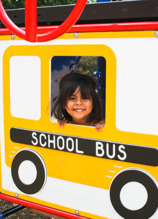 Hispanic Preschooler on playground busの写真素材