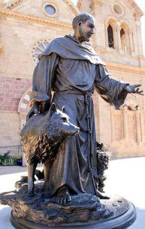Bronze Statue of Catholic Saint with Dogのeditorial素材