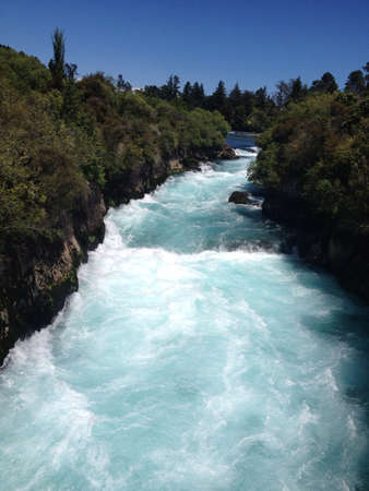 Water flowing swiftly down the riverの素材