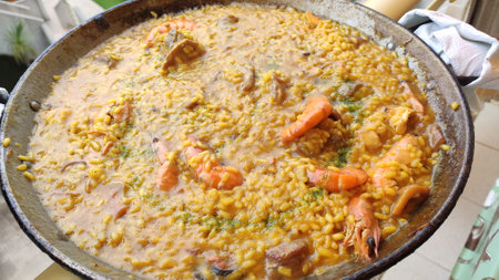 Typical spanish seafood paella in traditional panの写真素材