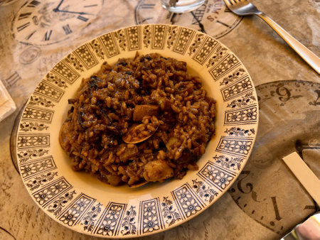 Risotto in a plate on a wooden table. Italian cuisineの写真素材