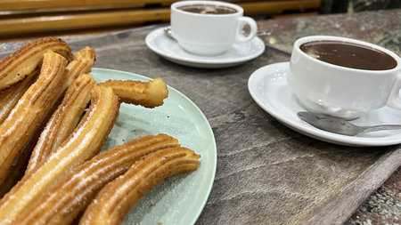 Tasty spanish traditional meal churros with chocolate.の写真素材
