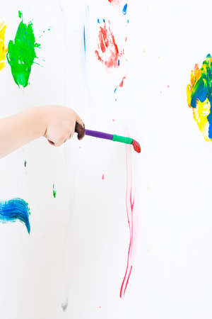 Three year old boy's hand paintingの写真素材