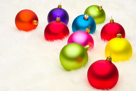 Christmas baubles on white furの写真素材