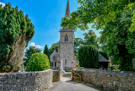The Parish Church of Saint Mary Lower Slaughter is located in Lower Slaughter, Gloucestershire. England UK. The 13th century Anglican parish church is located on the edge of Lower Slaughter village and there is a war memorial in the churchyard.のeditorial素材