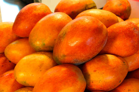 Fresh Mangoes closeup for sale at marketの写真素材