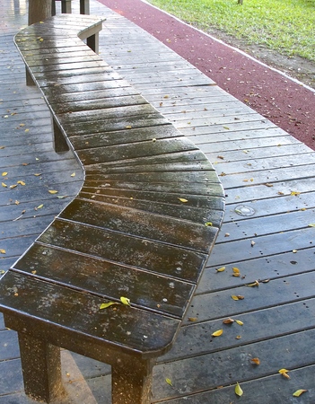 The curved bench located on school playgroundの写真素材