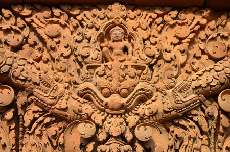 Detail of one of the multiple reliefs of the temple of Banteay Srei Angkor Cambodiaの写真素材