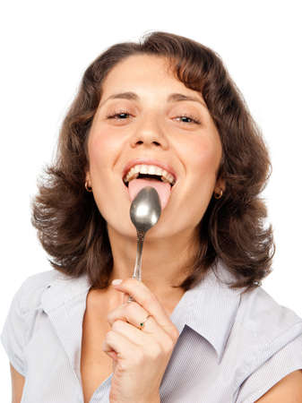 Pretty girl licks the spoonの写真素材