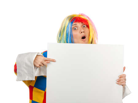 Funny clown point to the blank boardの写真素材