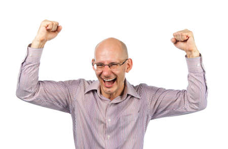 Bespectacled man rejoices victoryの写真素材