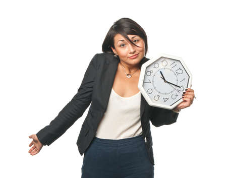Distraught young businesswoman with a big clock