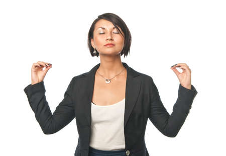 Young businesswoman doing office yogaの写真素材