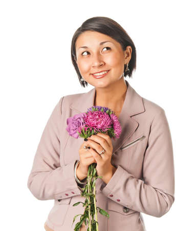 Beautiful young woman with a bouquet of flowersの写真素材