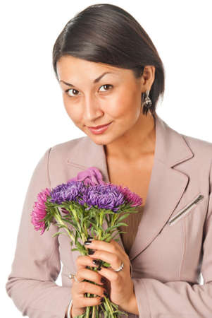 Beautiful young woman with a bouquet of flowersの写真素材