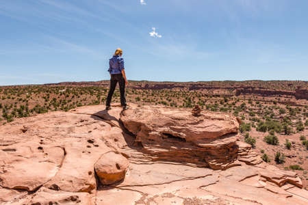 Woman Surveying the Peakの写真素材