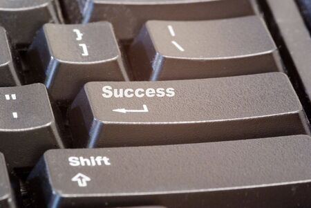 A keyboard with a success button on it