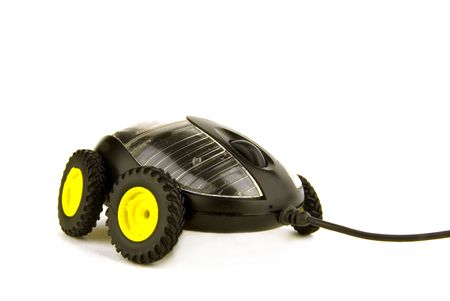 a computer mouse on wheels on white backgroundの写真素材
