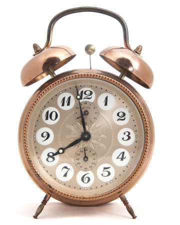 Classic clock isolated made of metal の写真素材