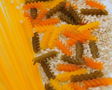 Texture made of italian pasta like macaroni espaguetti and rice の写真素材
