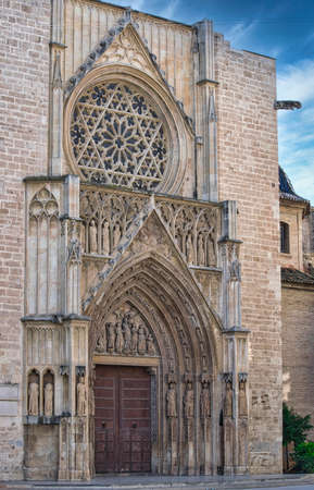 Facade and rose window of the cathedral of Valenciaの写真素材