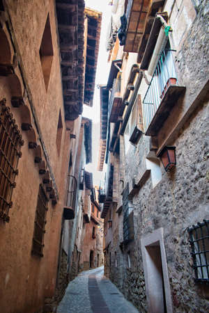Narrow street of medieval architecture in the town of Albarracin, Teruelの写真素材