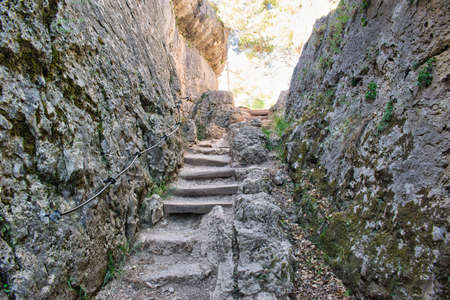 Staircase between two rocky walls in the natural setting of La Ciudad Encantada in Cuenca