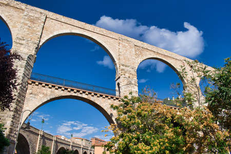Medieval aqueduct of the Arches in the city of Teruel, Spain. 16th centuryの写真素材