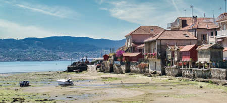Beautiful fishing village on the Galician coast of Combarro, with its traditional horreos