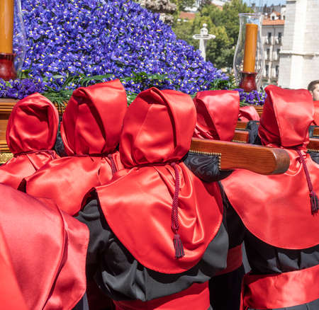 Holy Week Valladolid, detail of the red hoods of the Cristo de la Luz university brotherhood during Holy Thursdayの写真素材
