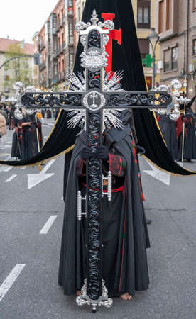 Holy Week Valladolid, bearer of the sacred cross brotherhood of our lady of piety in procession...
