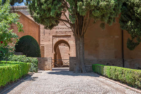Gate, courtyard and gardens within the grounds of the Alhambra in Granada, Spainの写真素材