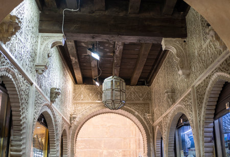 Detail of a passage of Nasrid architecture to access the bazaar of the AlcaicerÃ­a in Granada, Spainのeditorial素材