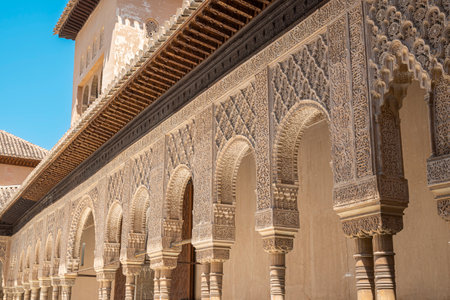 Detail of columns and arches decorated with Moorish Nasrid art in the Courtyard of the Lions of the Alhambra in Granada, Spainのeditorial素材